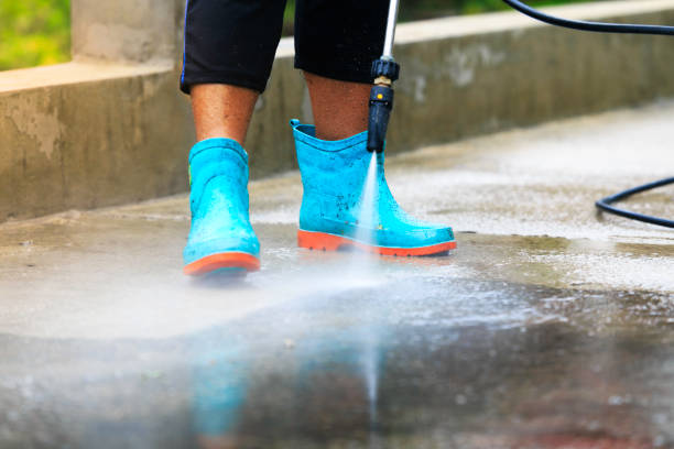 Wearing non-slip shoes and using a gas pressure washer